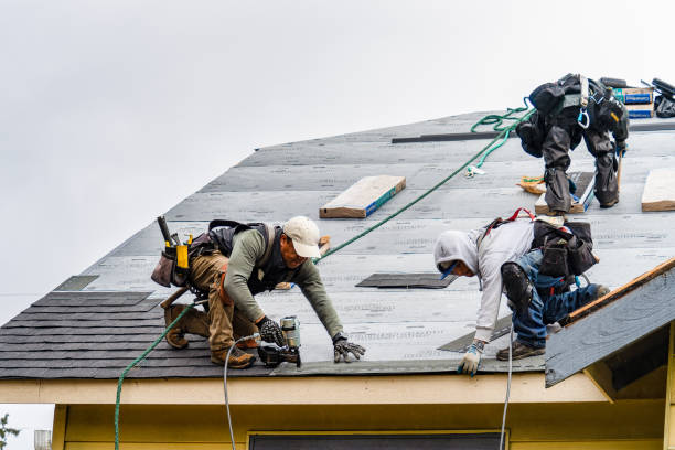 Professional Gutter Installation technician working in Essex Junction, VT